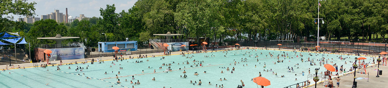 People using a city pool.
