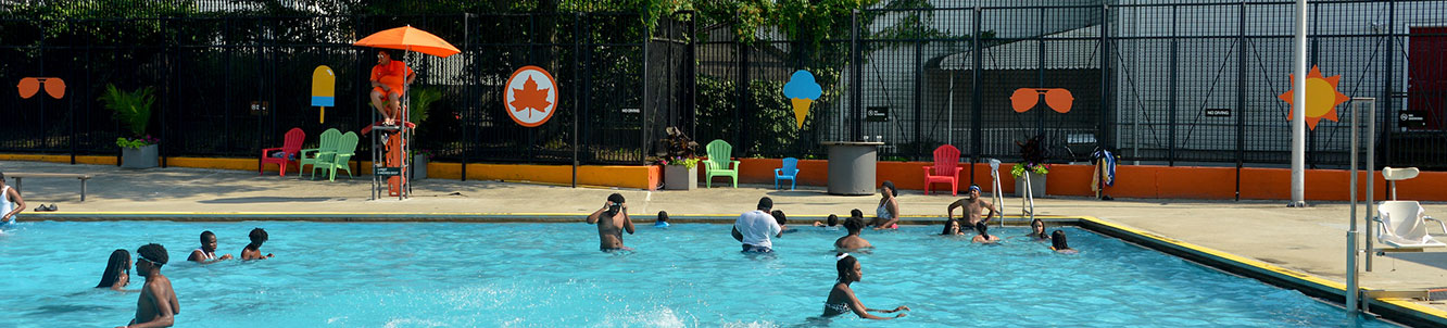 People using a city pool.