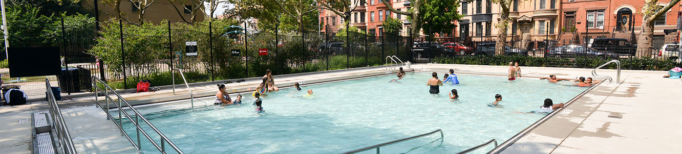 People using a city pool.