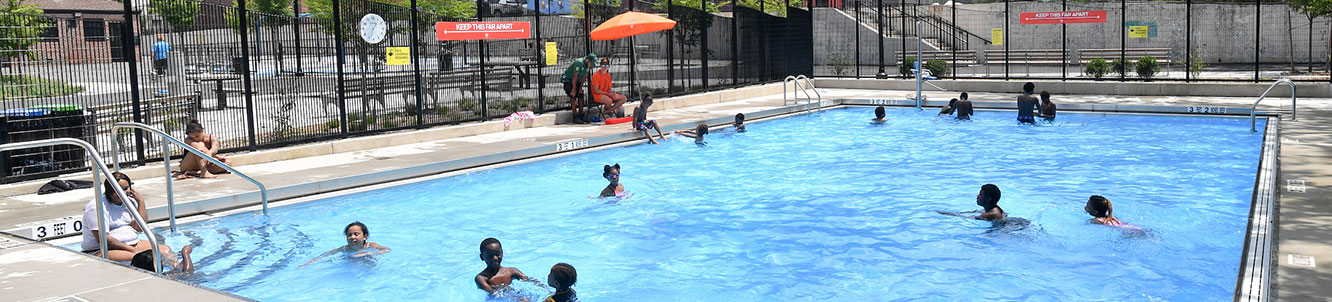 People using a city pool.