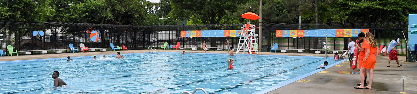 People using a city pool.