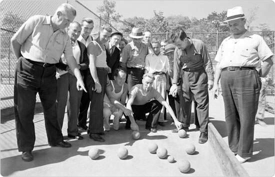 Men gather on the Crotona Park bocce courts, September 18, 1941. Courtesy of Parks Photo Archive, Neg. 20735.