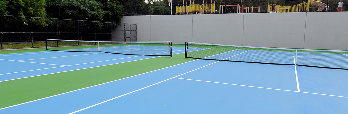 A row of newly resurfaced tennis courts.