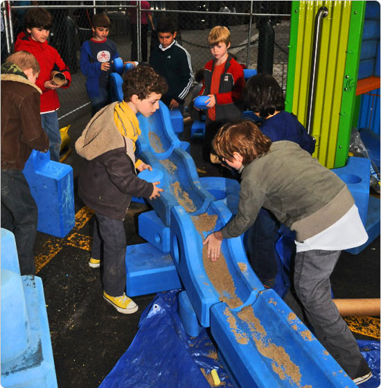 Children construct playspaces for themselves at the groundbreaking for Burling Slip?s Imagination playground, May 7, 2009. Photo by Malcolm Pinckney.