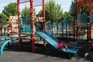 Children Play in Baisley Pond Park Playground 