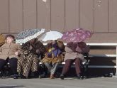 First sunny days in weeks during 2003/2004 winter. Sitting on bench along Brighton Beach Boardwalk. 