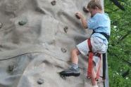 Enjoying the challenge of a rock climbing wall 