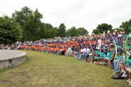 A crowd gathers to watch a performer at the new amphitheater 