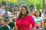 Oprah stands in the audience 