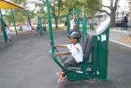 Trying out workout equipment at Robert Venable Park 